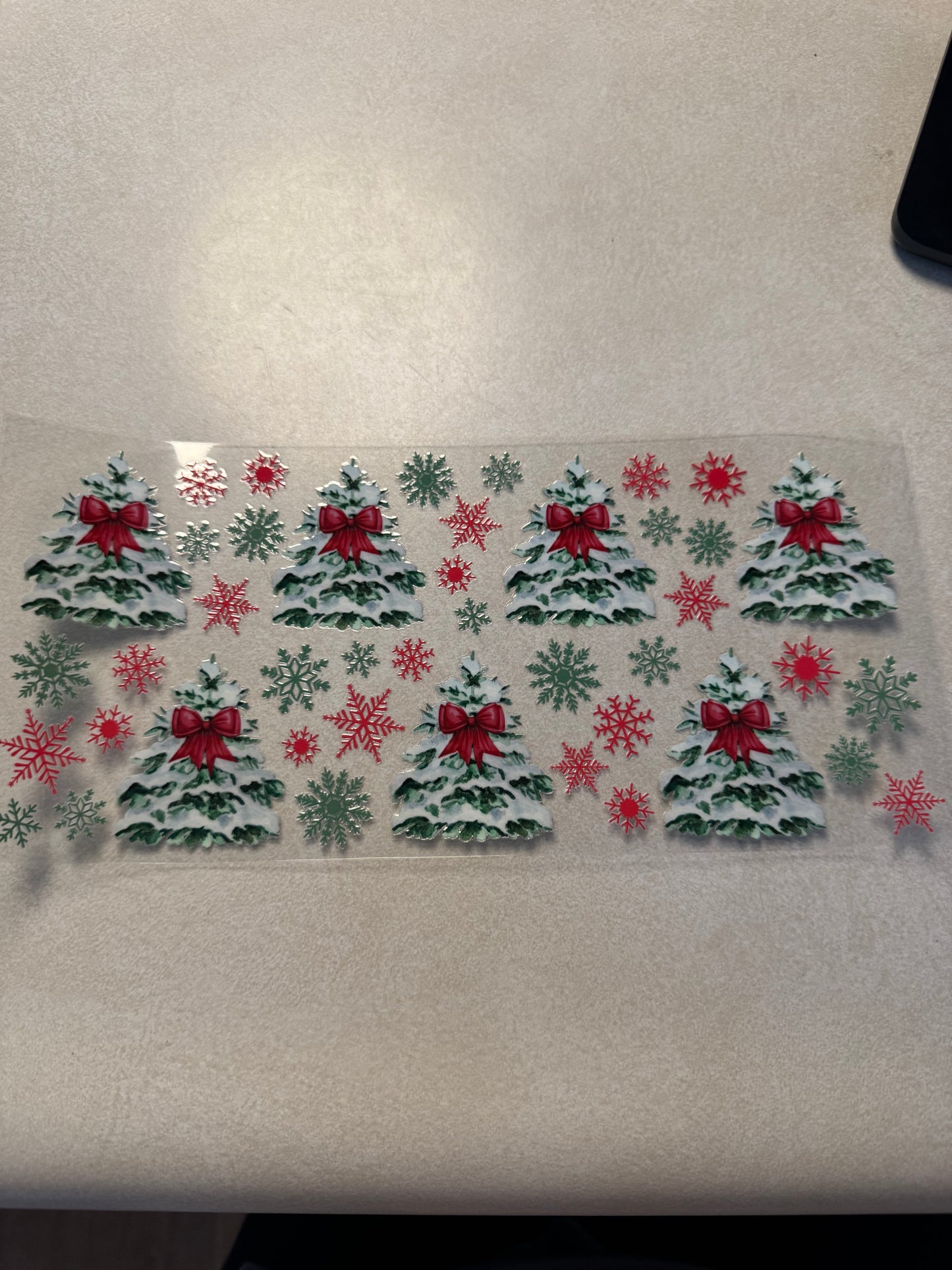 Snow covered trees with red bows
