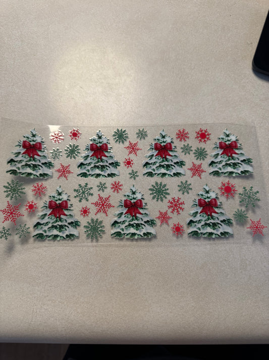 Snow covered trees with red bows
